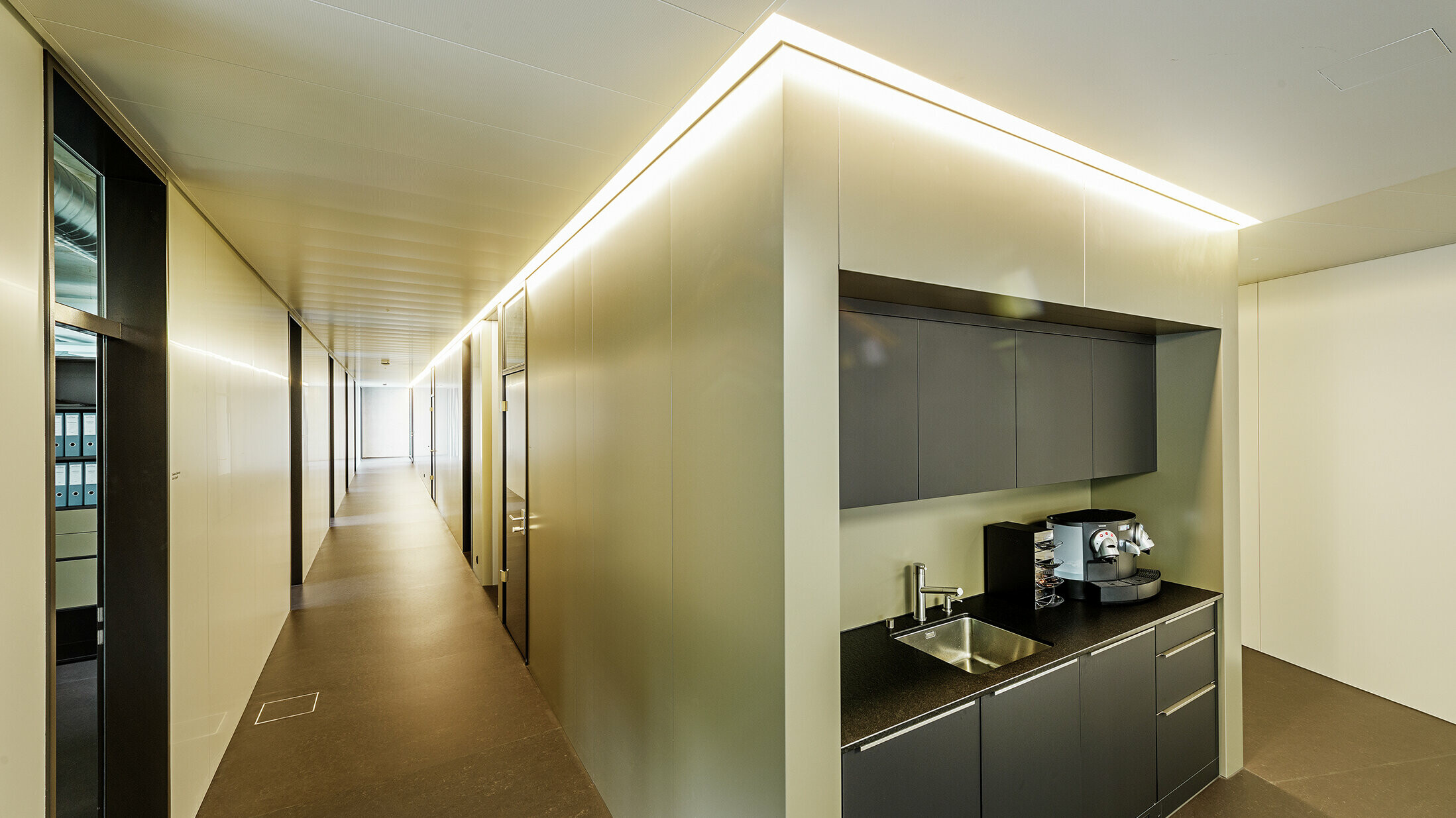Interior design with indirect lighting with aluminium composite panels in bronze