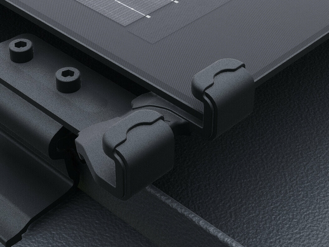 Close-up of the PREFALZ solar panel with black solar module safety lock. The panels are installed directly to the seams on the PREFALZ roof system. 