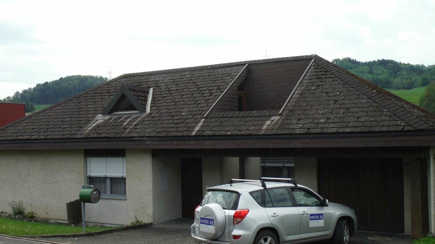 Before roof renovation with PREFA roof tiles and a pitched dormer