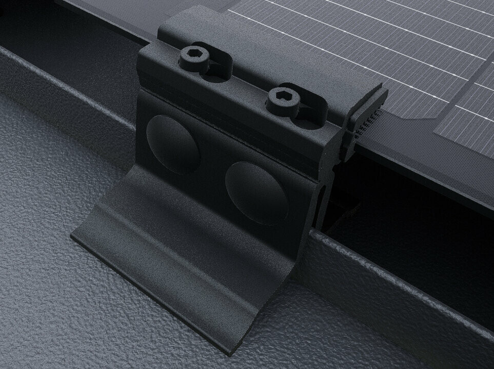 Close-up of the PREFALZ solar panel with black end clamps. The panels are installed directly on the seams on the PREFALZ roof system. 