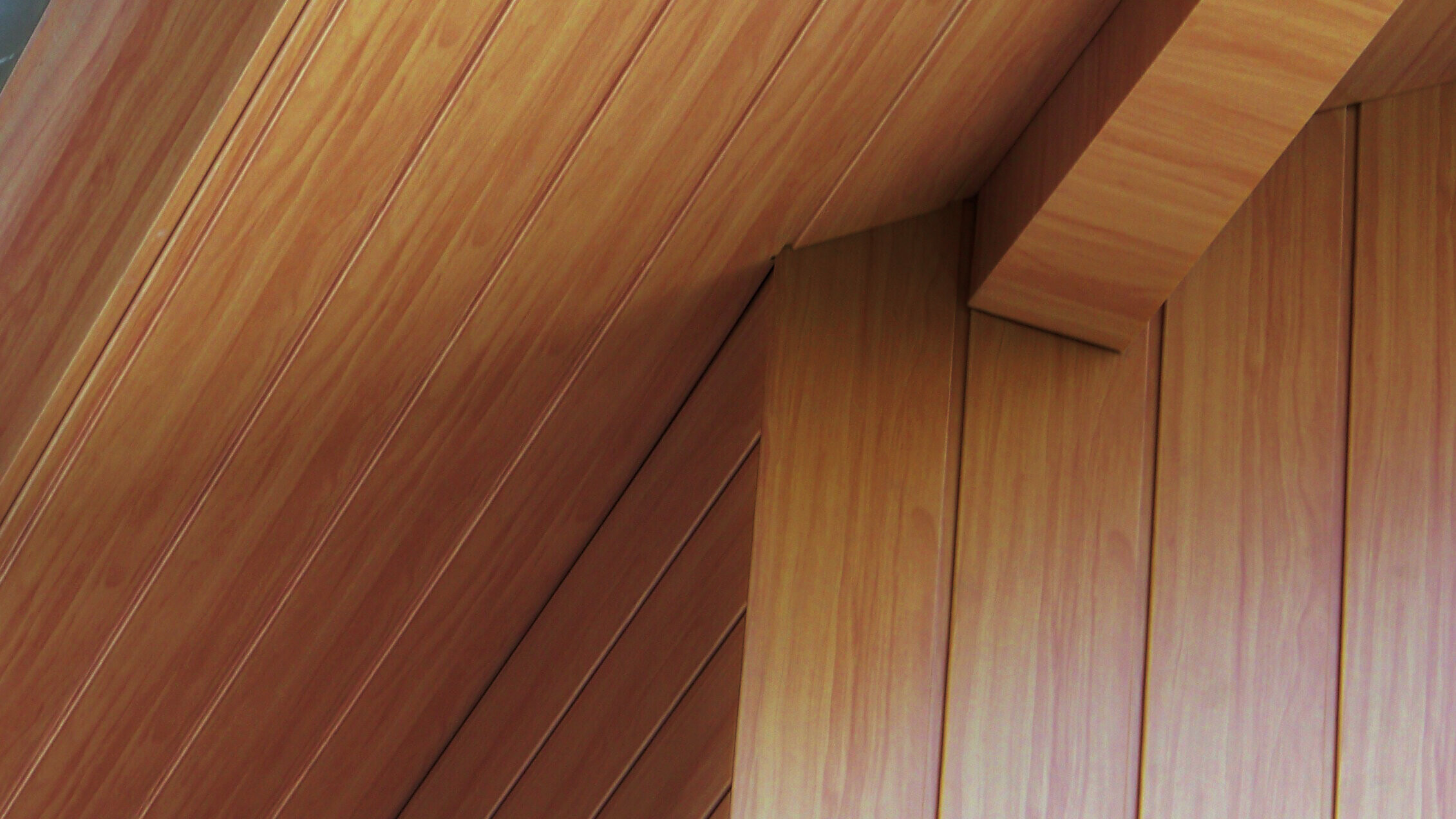 Soffit clad with aluminium PREFA sidings in light wood.